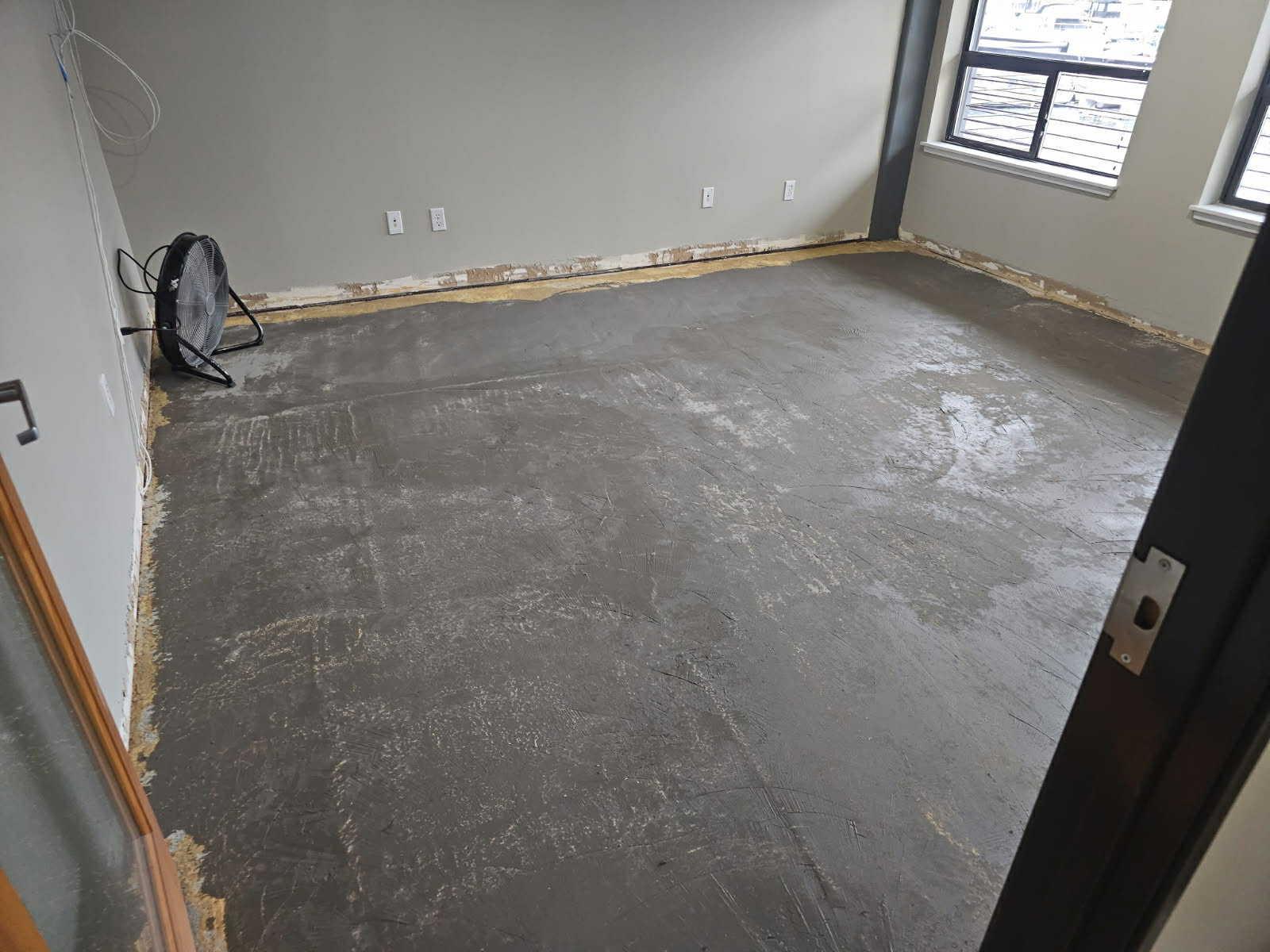 Subfloor preparation and baseboard trim