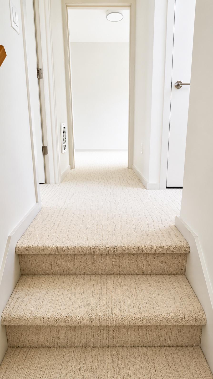 Soft beige carpet installed in hallway and stairs